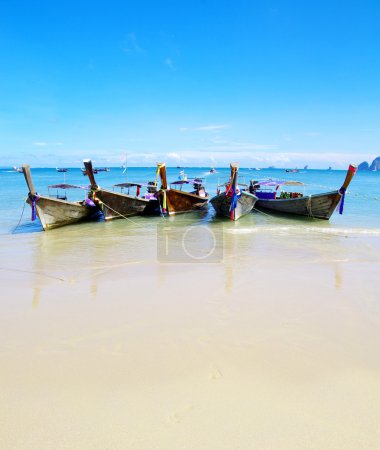 Tropical beach and longtail boats