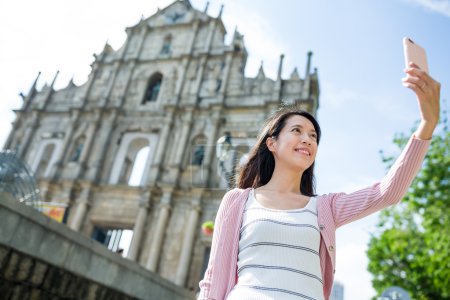 Woman taking selfie in Macau