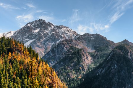 Beautiful snow-capped mountains on blue sky background