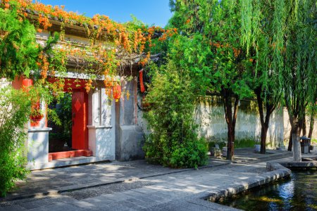 Red doors leading into courtyard of Chinese house, Dali Old Town