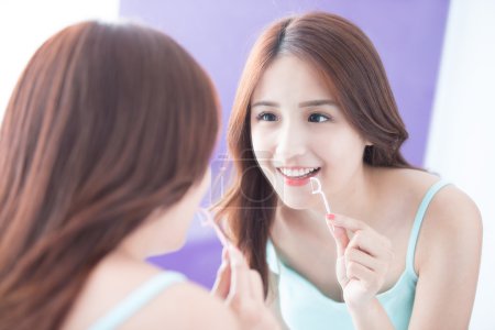 Smile woman with teeth floss