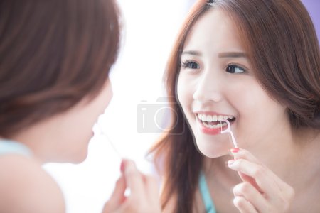 Smile woman with teeth floss