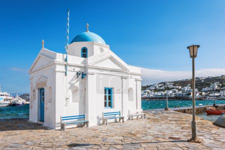 Whitewashed and blue domed Agios Nikolaos church in Mykonos