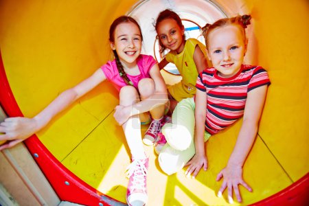 Girls in playground slide