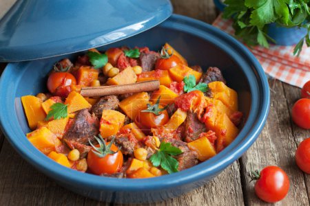 Moroccan Tagine with beef, chickpeas,  pumpkin and cherry tomato