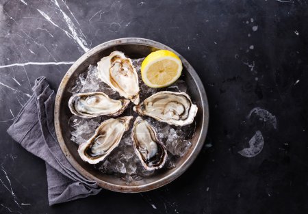 Opened Oysters with ice and lemon