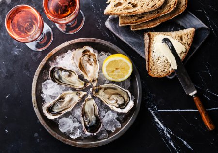 Opened Oysters with bread, butter and wine