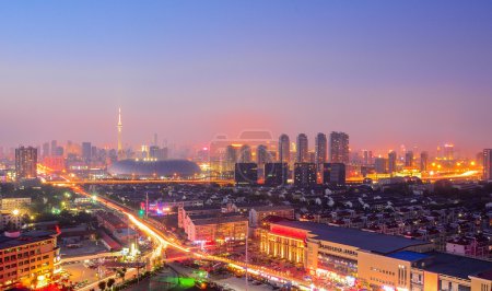 Cityscape of  Tianjin city China at twilight dusk night.