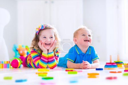 Cjildren playing with wooden toys