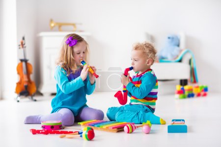 Boy and girl playing flute