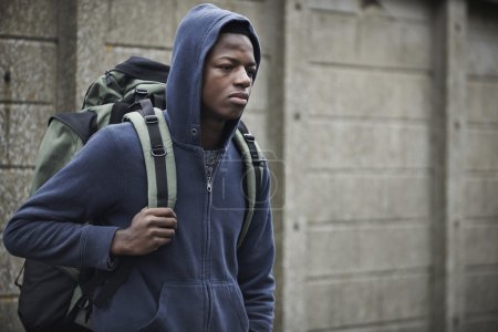 Teenage Boy On The Streets With Rucksack