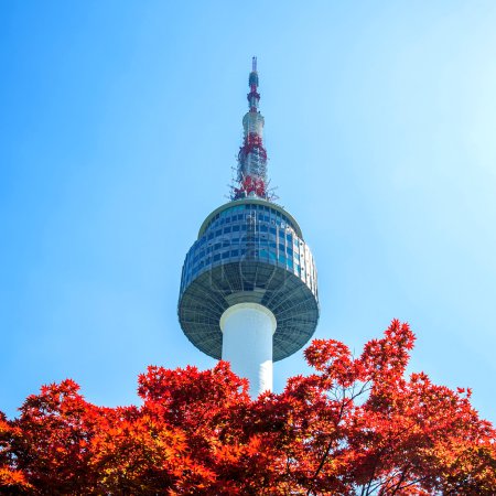 Seoul Tower and red autumn maple leaves at Namsan mountain in South Korea.