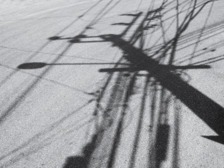 Electric pole mess wiring cable shadow on Street Urban 