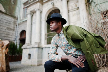 Fashion portrait of black african american man on green velvet j