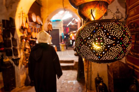 Woman walks past a lantern shop