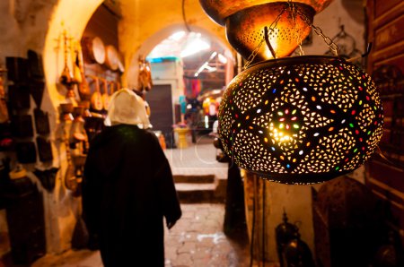 Woman walks past a lantern shop