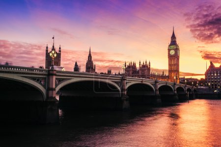Dramatic sunset over famous Big Ben clock tower in London, UK.