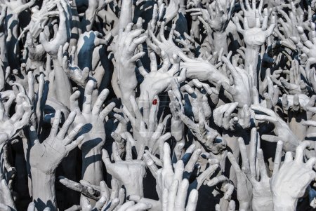 Hands statue from hell in Wat Rong Khun. Chiang Rai, Chiang Mai province, Thailand