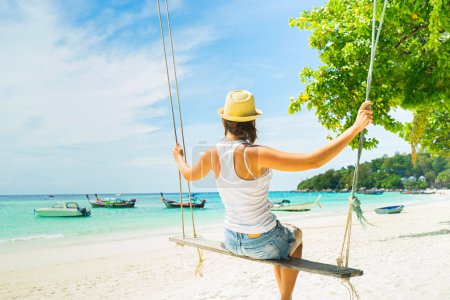  tourist  swinging on  beach