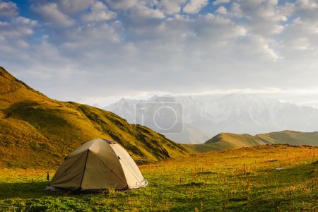 Tourist tent in camp on meadow