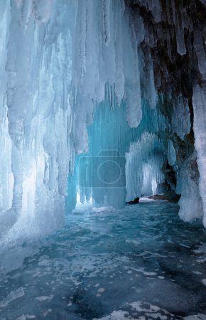 Ice cave on Olkhon island on Baikal lake in Siberia at winter time