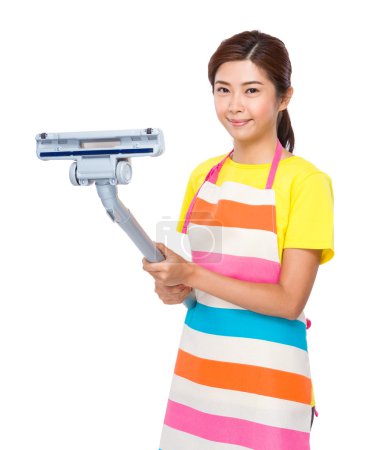 Housewife holding dust vacuum