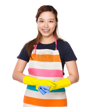 Housewife with gloves and rag