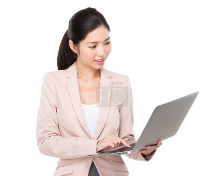 Young asian businesswoman using notebook