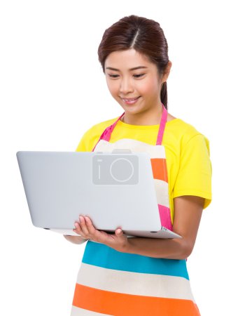 Asian Housewife using notebook computer