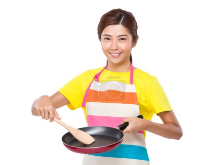 Young asian Housewife making food
