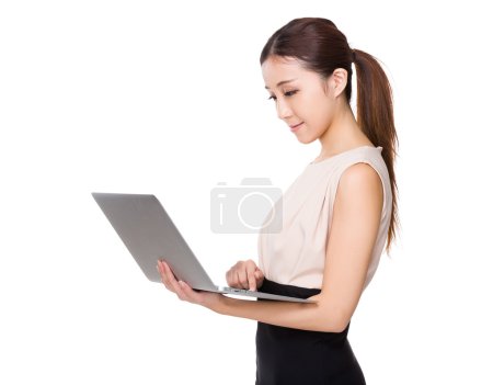 Young asian businesswoman in beige dress