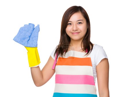 Housewife wear with plastic gloves and rag