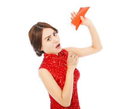 Surprised asian young woman point to a empty red envelope 