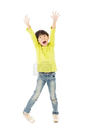 Happy little boy with arms up celebrating