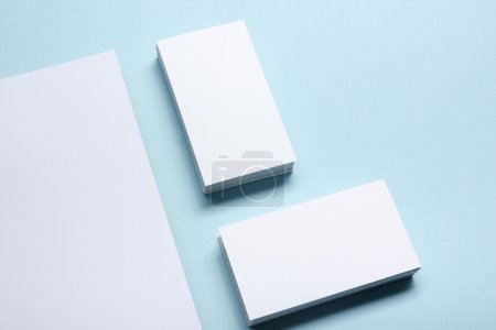 Business card blank over office table. Corporate stationery branding mock-up