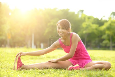 Woman performs stretching