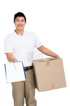 Delivery man with cardboard box and clipboard