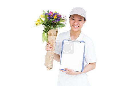 Delivery woman with bouquet and clipboard