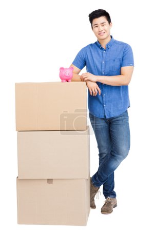 Man standing near cardboard boxes