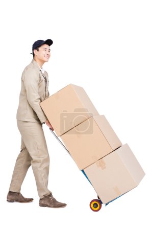 Delivery man moving luggage trolley