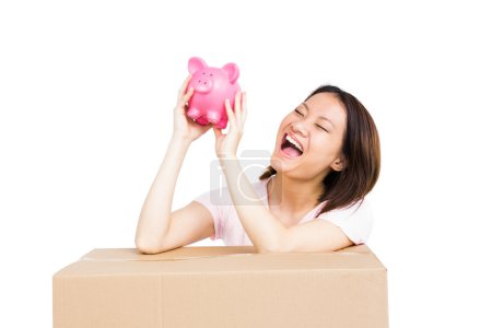 Woman holding piggy bank