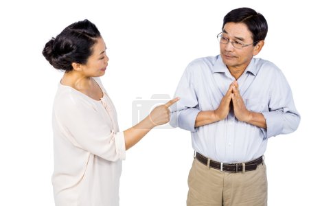 Older asian couple having an argument