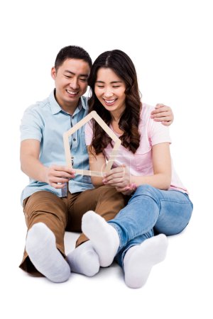 Affectionate couple holding frame