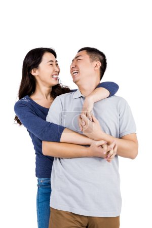Cheerful woman embracing man