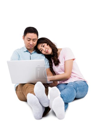 Couple working on laptop