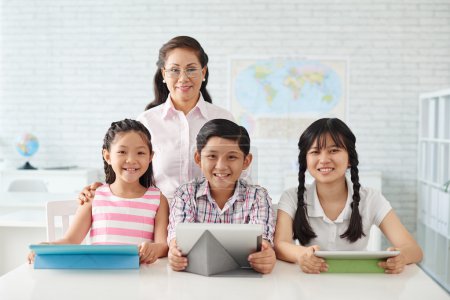 Pupils and teacher in class