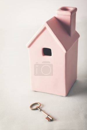 Toy pink house with gold key 