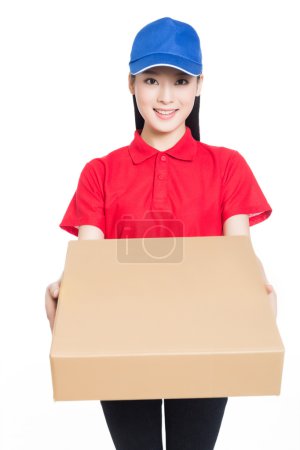 Delivery woman carrying cardboard box