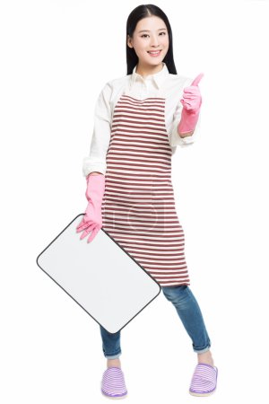 Cleaning woman showing blank sign board