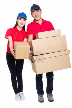 Young man and woman carrying cardboard box